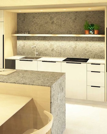 Küche mit Insel und Esstisch im Chalet.