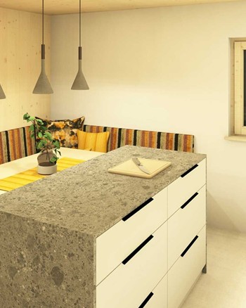 Küche mit Insel und Esstisch im Chalet.