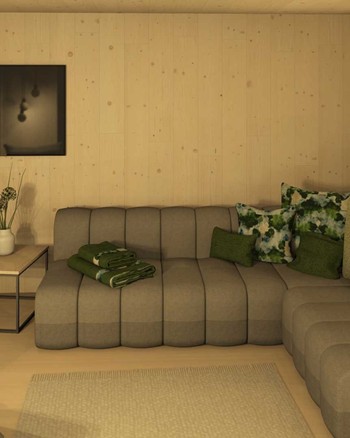 Wohnzimmer mit Fernseher und Couch mit grünen Akzenten.