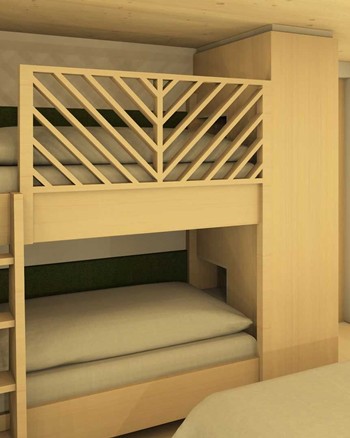 Stockbett mit grünen Farbakzenten im Kinderzimmer des Chalets.