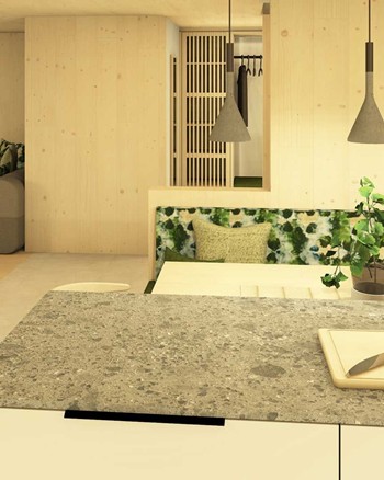 Kücheninsel und Esstisch mit Sitzbank und Blick zum Sofa im Wohnzimmer.